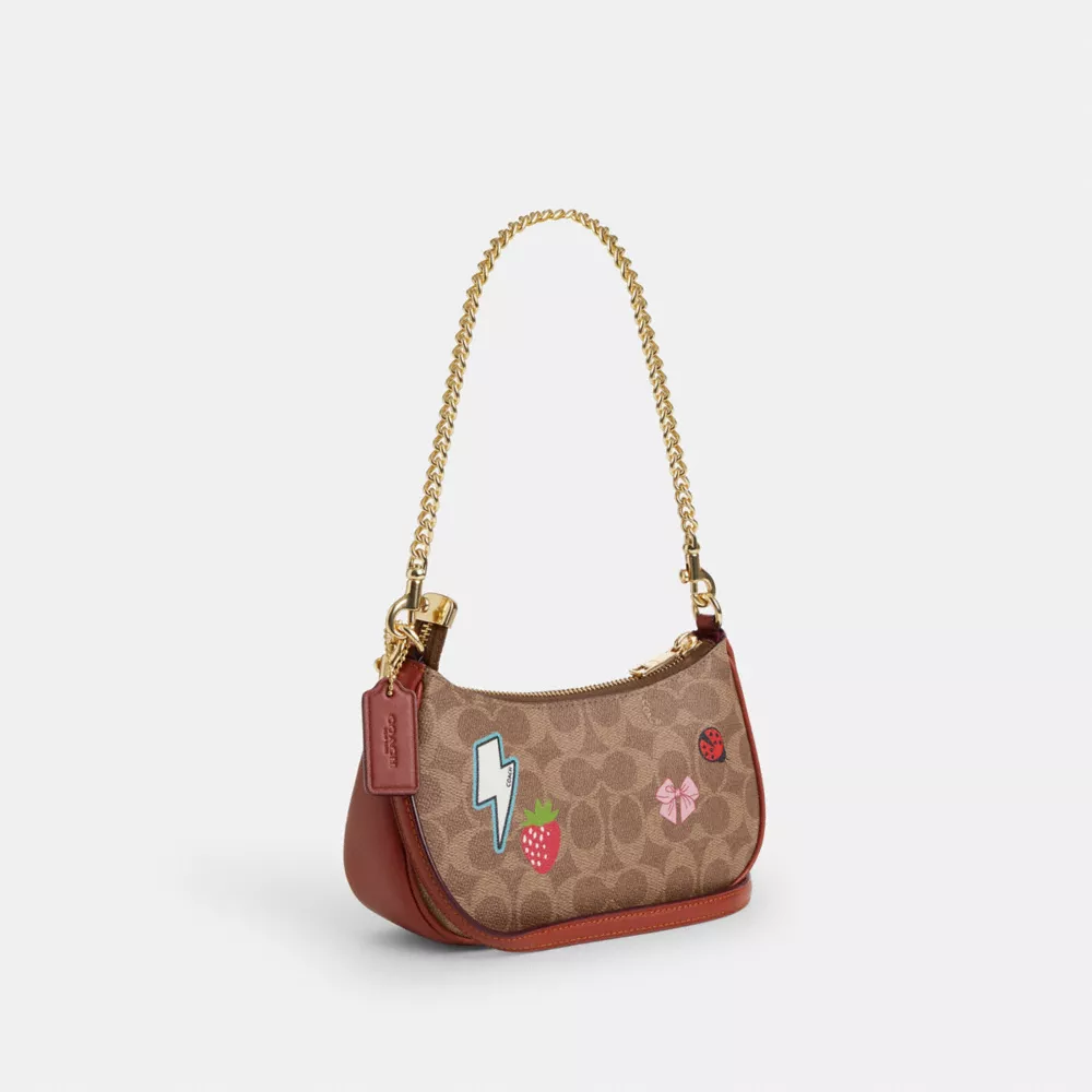 Teri Mini Crossbody Bag In Signature Canvas With Sticker Print